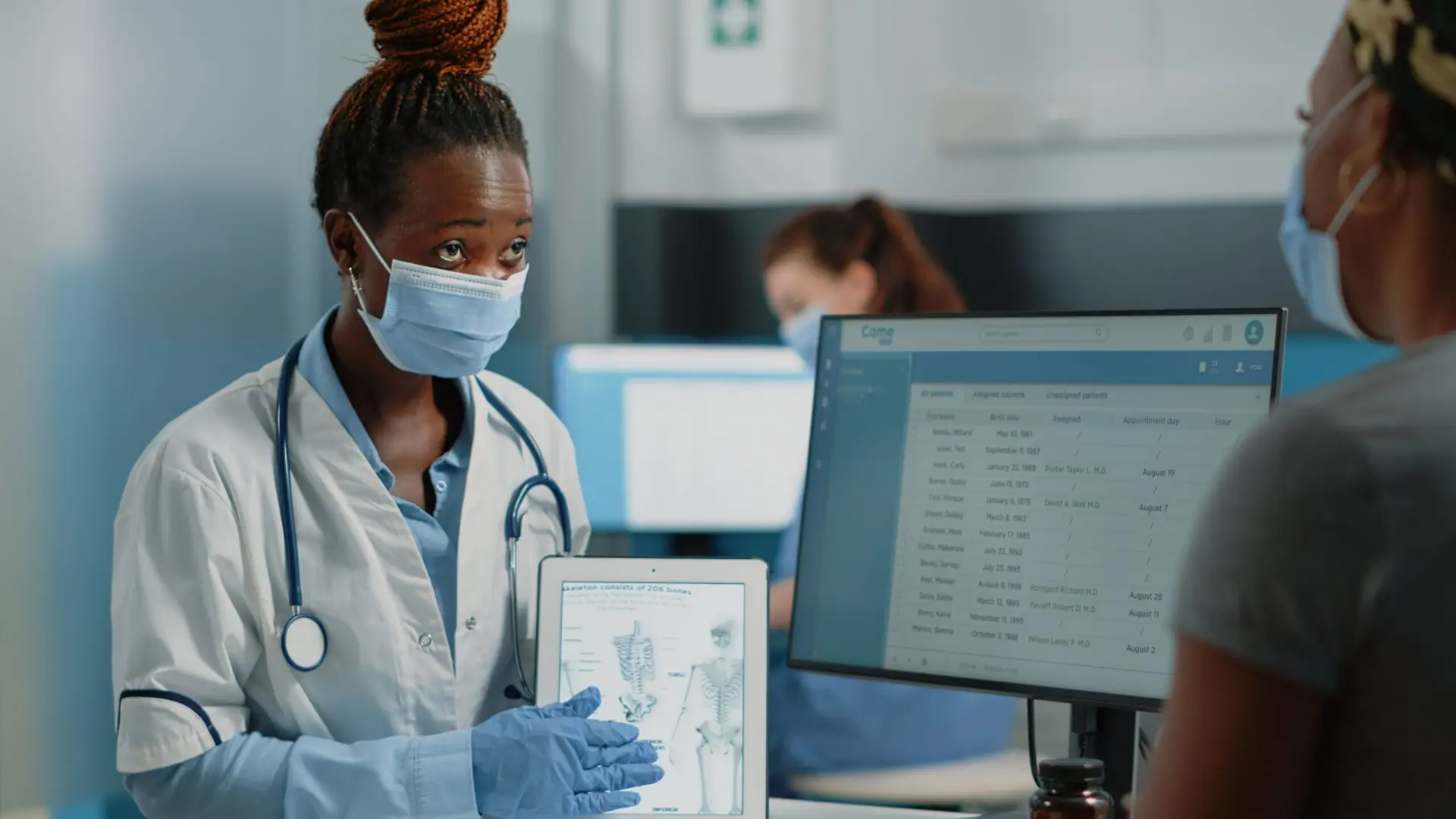 medic-showing-tablet-with-human-skeleton-patient-osteopathy-diagnosis-checkup-medical-consultation-doctor-holding-bones-anatomy-gadget-osteoporosis-fracture-min